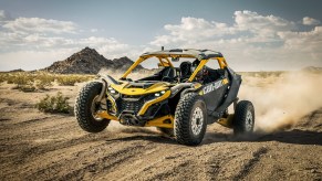 The 2024 Cam-Am Maverick R kicking up sand