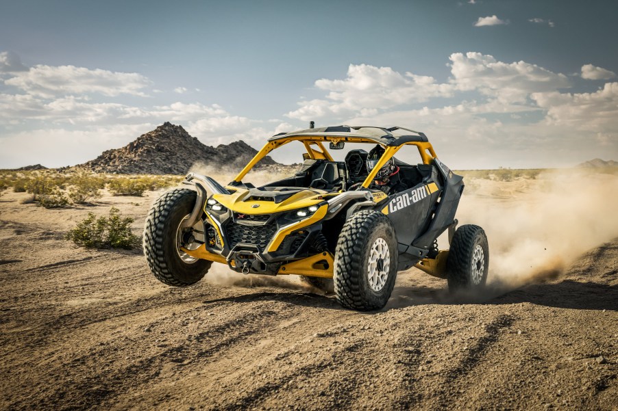 The 2024 Cam-Am Maverick R kicking up sand