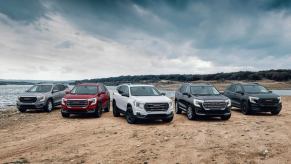 The 2024 GMC Terrain (L to R) SLE, SLT, AT4, Denali, and Elevation Edition trim level models