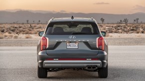 The rear of a gray 2024 Hyundai Palisade in the desert. The 2024 Hyundai Palisade's price might be a sticking point when fully loaded.