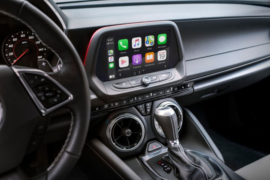 Black interior of 2024 Chevrolet Camaro with automatic transmission showing the touchscreen infotainment system.