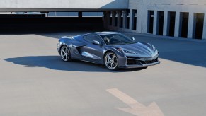 Gray 2024 Chevy Corvette E-Ray 3LZ parked in front of a garage. 2024 Chevy Corvette models are super popular