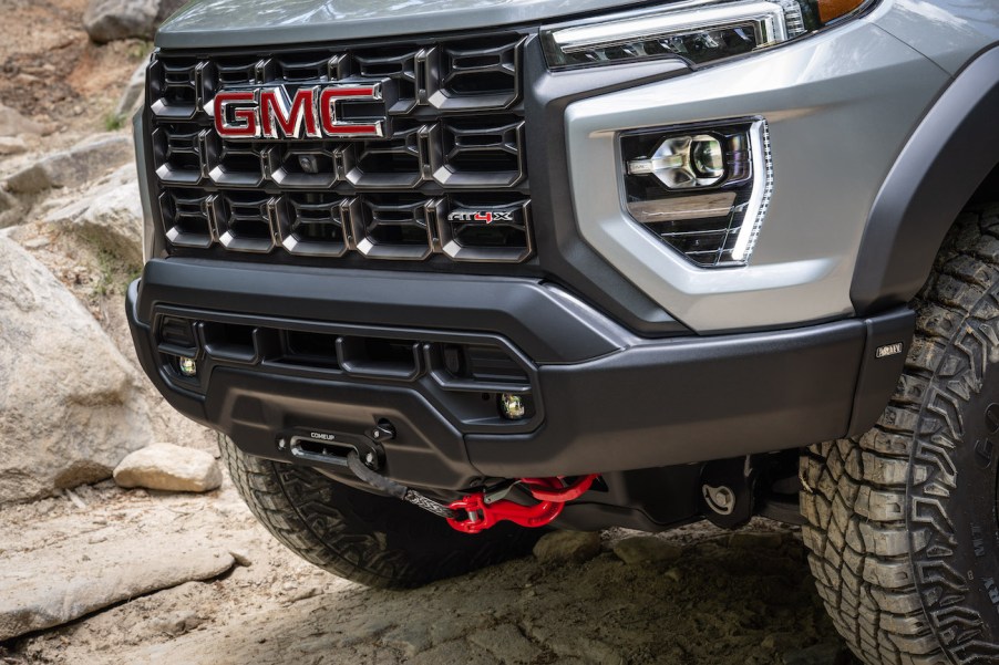 The 2024 GMC Canyon – Toyota Tacoma competitor – parked on a dusty and rocky road.