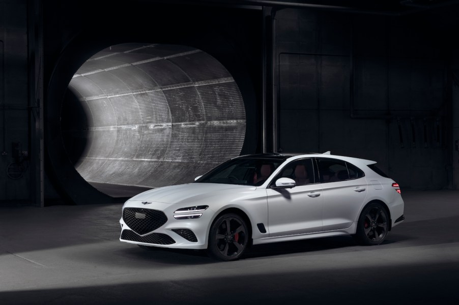 The cheapest new Genesis – Genesis G70 – in white on display in a tunnel.