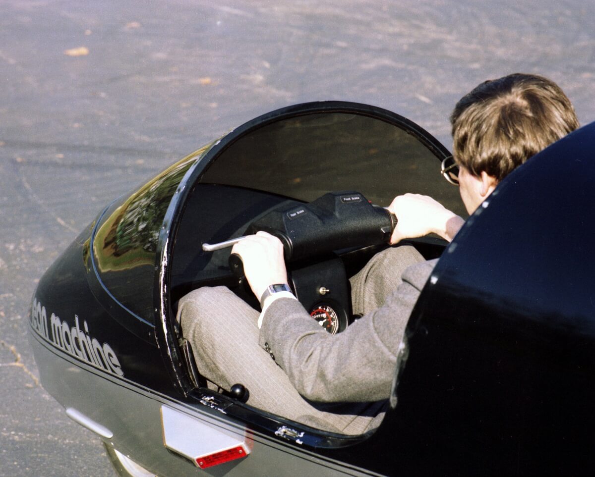 A General Motors concept three-wheeler shows off its handlebars and tight canopy.