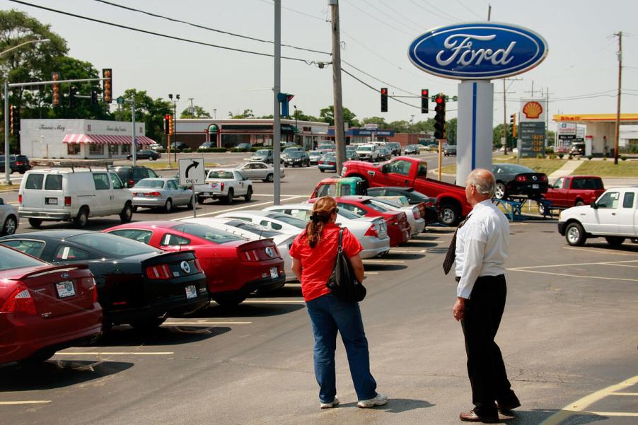 Car buyer and salesman at dealership