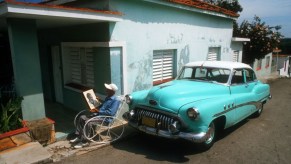 Old Buick next to house