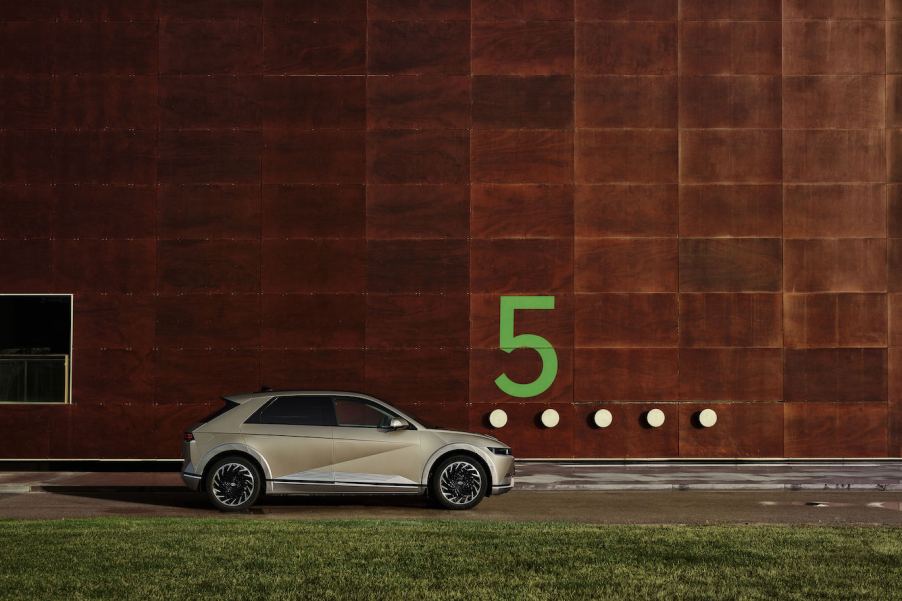 A silver 2023 Hyundai Ioniq 5 against a brick wall with a green 5. The Hyundai Ioniq 5's sales have ticked up