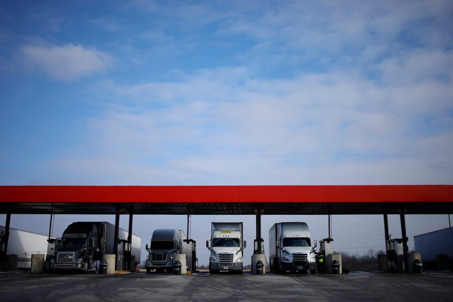 A series of semi-truck tractors with Indiana registration license plates.