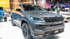 A Jeep Compass on display at an auto show.