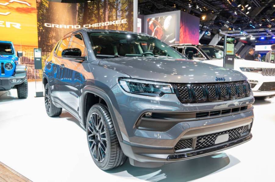 A Jeep Compass on display at an auto show.