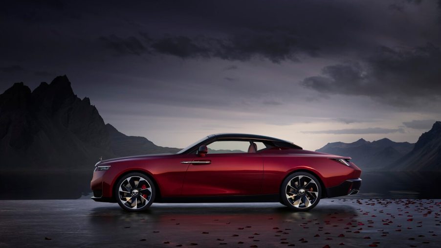 A red Rolls-Royce La Rose Noire Droptail shows off its side profile.