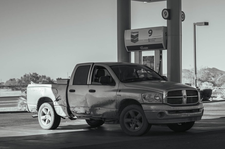 a fourth generation Ram 1500 at a gas station