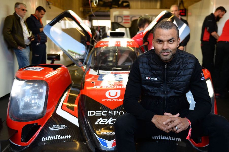 Former San Antonio Spurs basketball player Tony Parker poses in front of an Oreca 07 Gibson LMP2 car. Tony Parker's car collection is extensive.