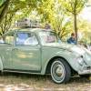 A Volkswagen Beetle on display outside.