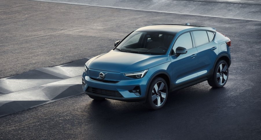 An overhead shot of a blue Volvo C40 Recharge on a graphite road. Volvo C40 sales are starting to pick up.