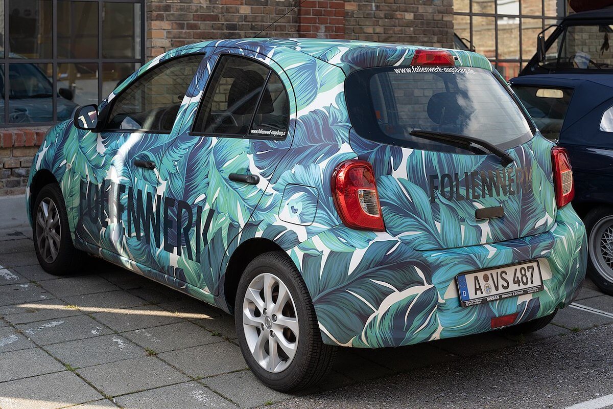 A vinyl-wrapped Toyota hatchback.