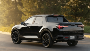 Black 2023 Hyundai Santa Cruz with trees in background