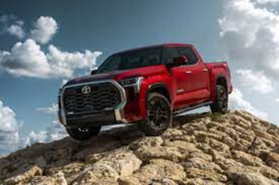 Red 2023 Toyota Tacoma pickup front 3/4 view