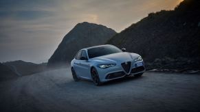 A 2024 Alfa Romeo Giulia Competizione compact executive car/sports sedan model in Moonlight Gray