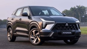 Charcoal gray 2024 Mitsubishi Xforce compact SUV at sunset