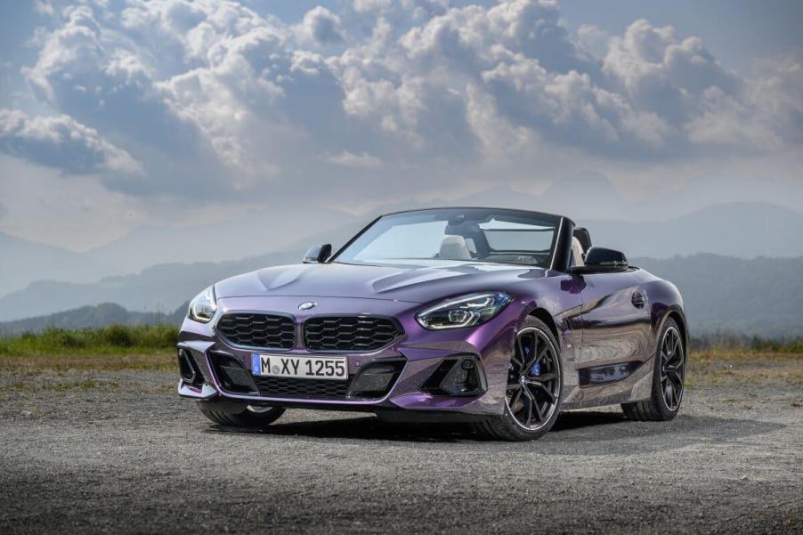 A BMW Z4 M40i performance-focused sports car coupe model parked on a gravel/sand plain