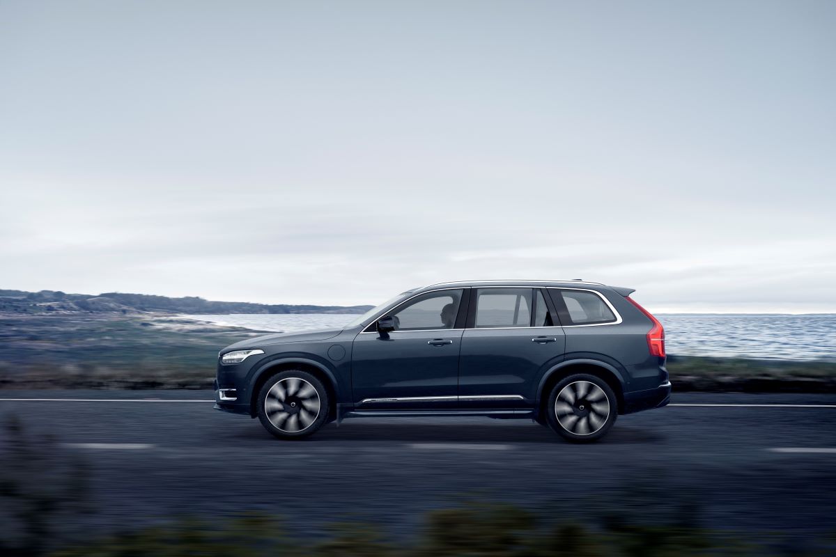 A side profile shot of a Volvo XC90 Recharge T8 with AWD midsize luxury plug-in hybrid SUV model