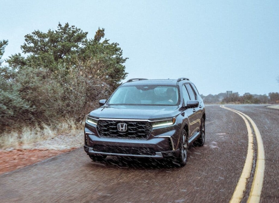 The 2023 Honda Pilot driving through a storm