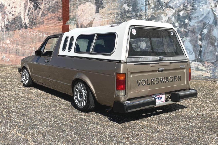 White cap on a beige VW Rabbit compact pickup truck.