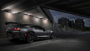 A gray 2019 Chevy Corvette ZR1 shows off its ZTK wing under an overpass.