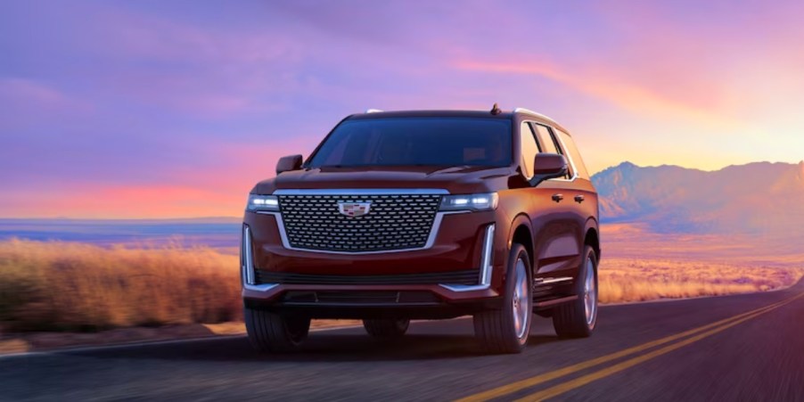 A red 2023 Cadillac Escalade full-size luxury SUV.