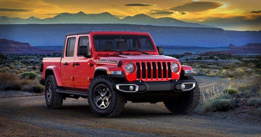 2023 Jeep Gladiator Texas Trail parked in a desert in front of mountains