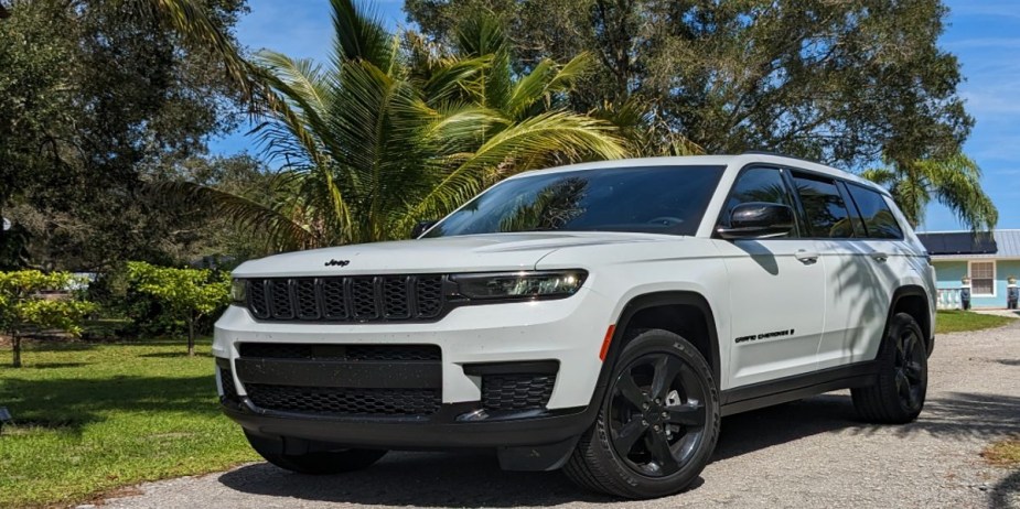 A white 2023 Jeep Grand Cherokee L midsize three-row SUV.