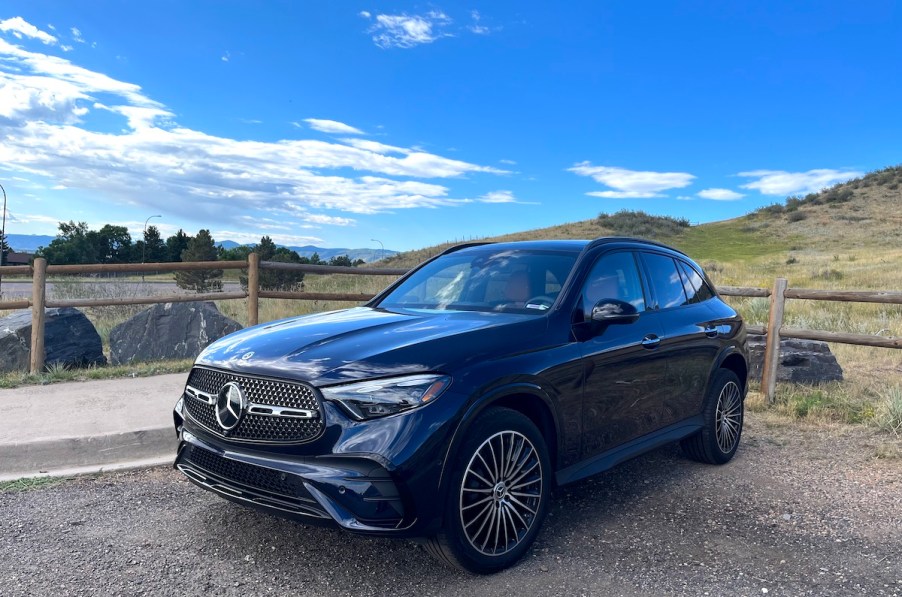 A front corner view of the 2023 Mercedes-Benz GLC 300 by a mountain