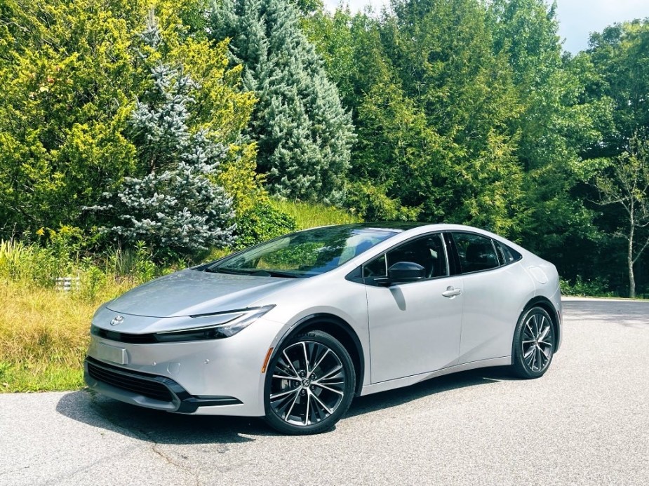 The 2023 Toyota Prius parked near foliage