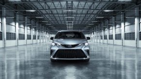 A silver 2023 Toyota Sienna on display in an abandoned building. Toyota Sienna sales are surprisingly high.