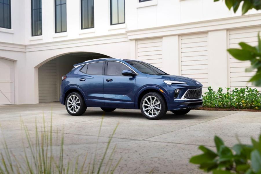 The 2024 Buick Encore GX Avenir subcompact SUV model parked on a driveway plaza