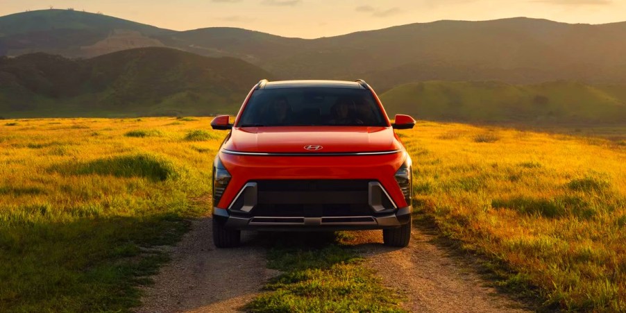 A 2024 Hyundai Kona subcompact SUV is parked in a field.