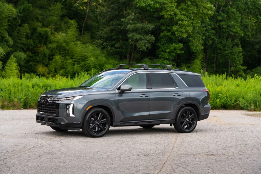 A gray 2024 Hyundai Palisade XRT parked in front of the woods. Hyundai Palisade sales are on the decline.