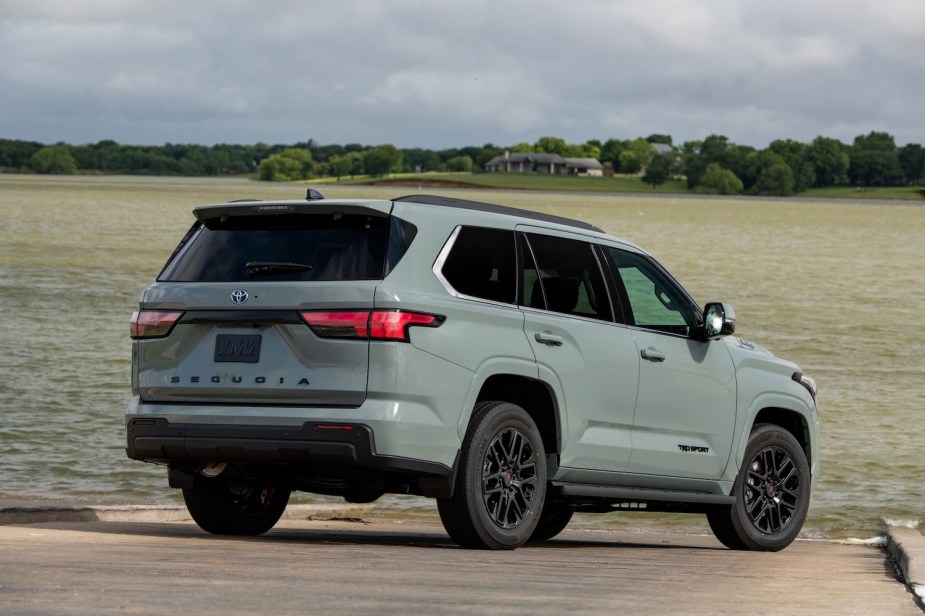 Grayinsh "Lunar Rock" Toyota SUV parked in front of a lake.