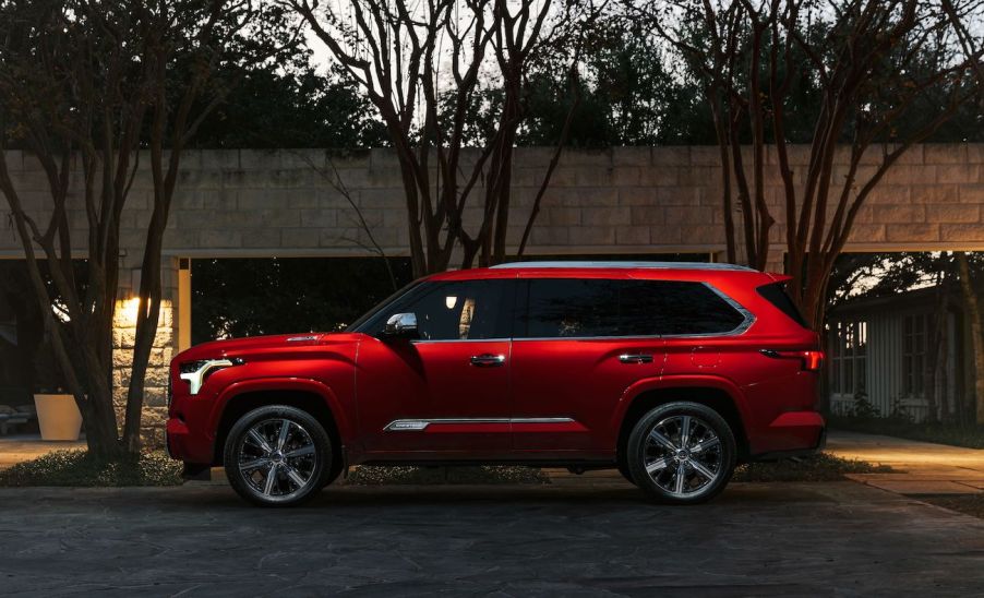 A red 2024 Toyota Sequoia at dusk. The 2024 Toyota Sequoia price can get pretty high up there.