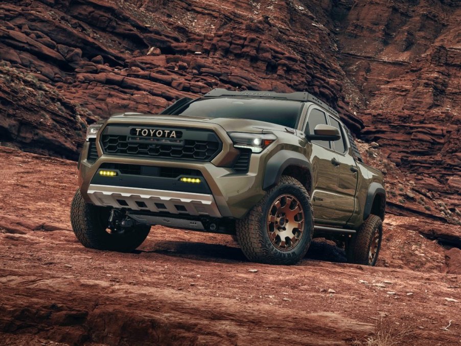 The 2024 Toyota Tacoma off-roading over rocks