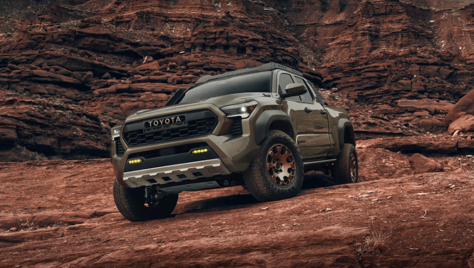 The 2024 Toyota Tacoma crawling over rocks