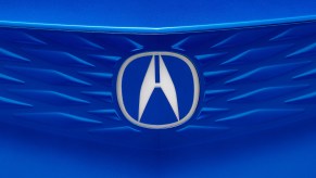 The blue front grille of a vehicle with Acura Super Handling.