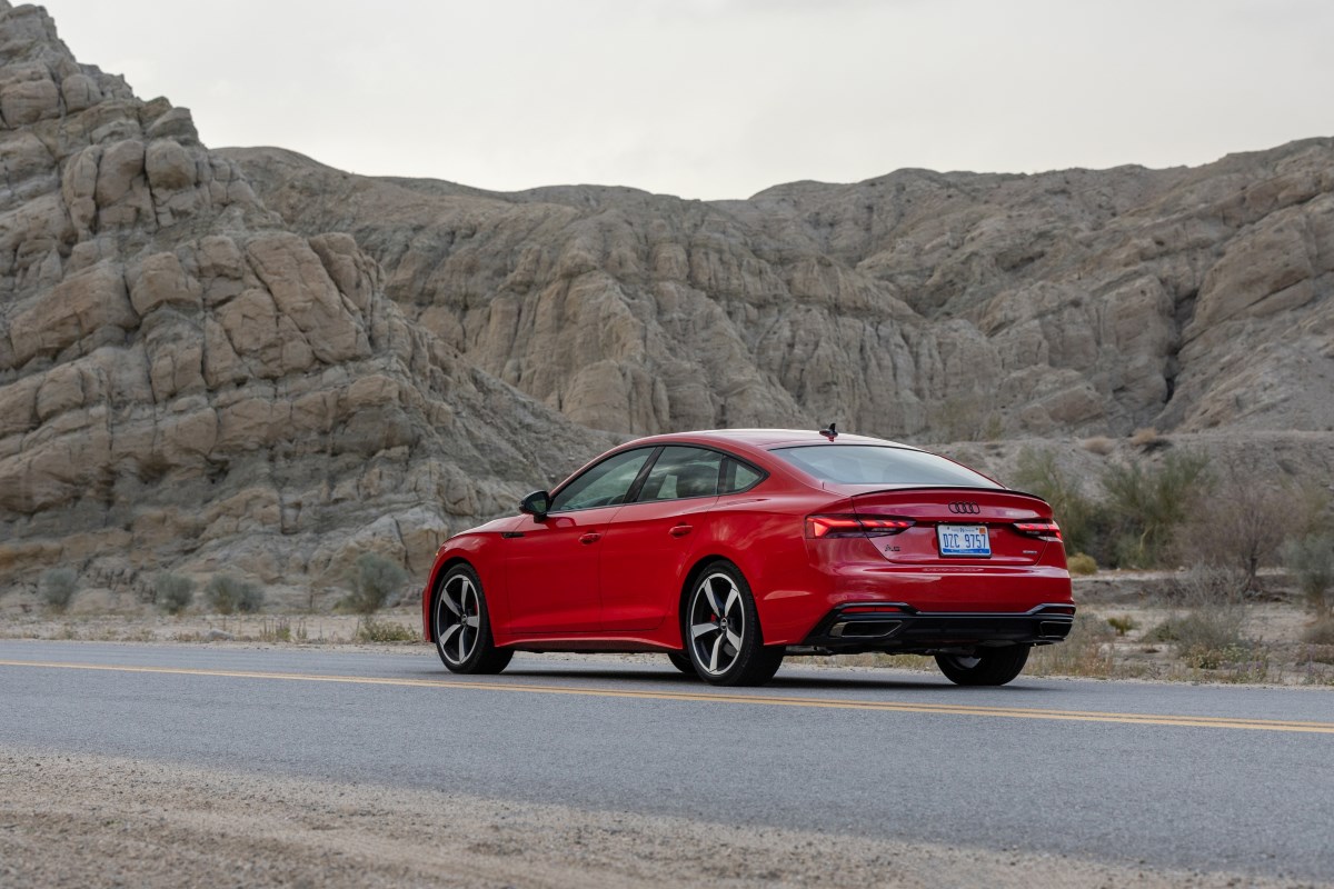 A red 2024 Audi A5 Sportback parked on the road