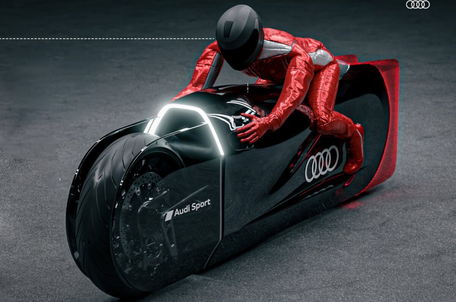 Audi Robosphere EV motorcycle concept with rider in studio shot