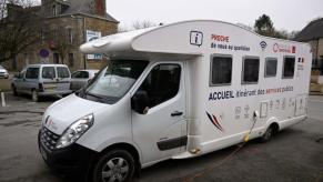 An electric RV parked on display.