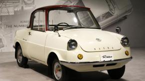 A Mazda R360 on display at a museum.