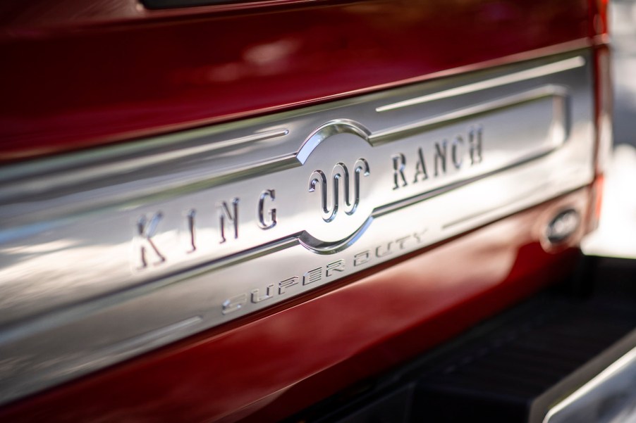 The King Ranch logo and name on the red tailgate of a top-trim Super Duty F-250 truck.