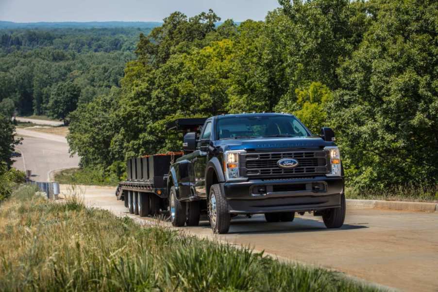 A Ford Super Duty F-450 towing a trailer.